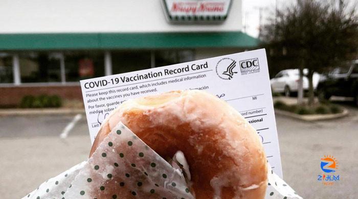 Biden encourages Americans to get COVID shots with free doughnuts