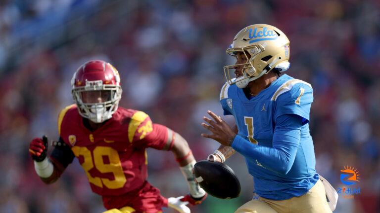 UCLA QB Dorian Thompson-Robinson signs autograph mid-game after touchdown vs. USC