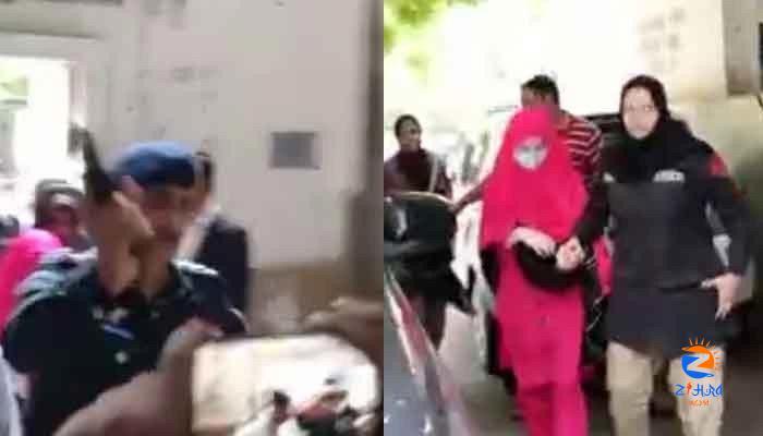 Cop threatens journalists with weapon as Dua appears in Karachi court