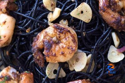 Slick and sumptuous: Jet-black squid ink pasta with garlic ‘sambal’ prawns