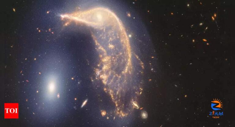 ‘Cosmic ballet’: Nasa unveils stunning images of two galaxies merging in Space